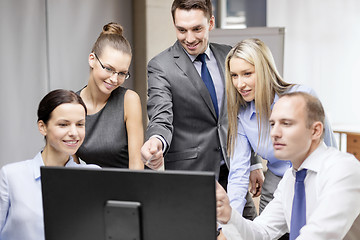 Image showing business team with monitor having discussion