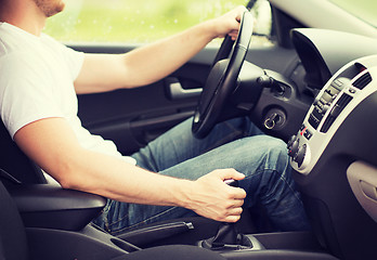 Image showing man shifting the gear on car manual gearbox