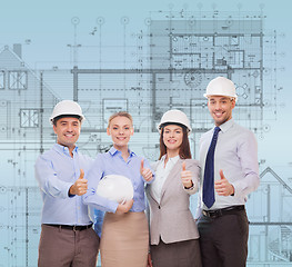 Image showing happy business team in office showing thumbs up