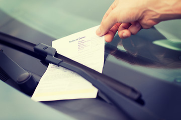 Image showing parking ticket on car windscreen