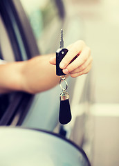 Image showing man with car key outside