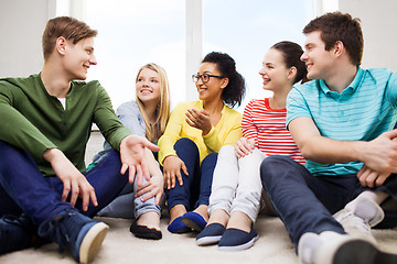 Image showing five smiling teenagers having fun at home