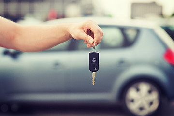 Image showing man with car key outside