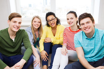 Image showing five smiling teenagers having fun at home