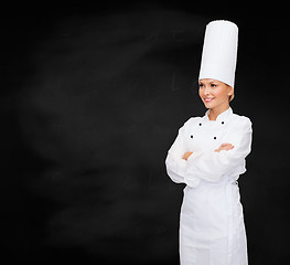 Image showing smiling female chef with crossed arms