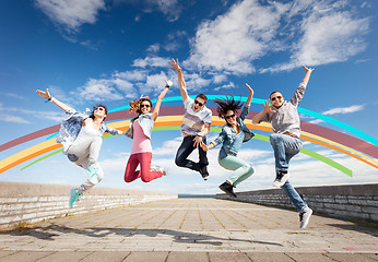 Image showing group of teenagers jumping