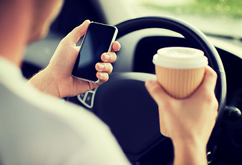 Image showing man using phone while driving the car