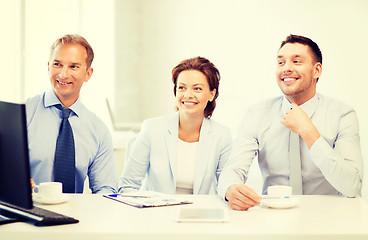 Image showing business team discussing something in office