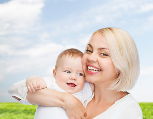 Image showing happy mother with smiling baby