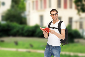 Image showing travelling student with backpack and book