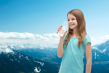 Image showing smiling little girl with glass of water