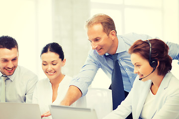 Image showing group of people working in call center