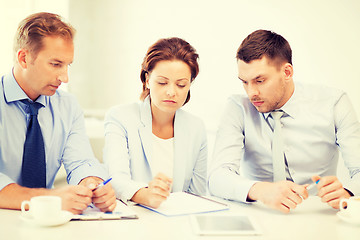 Image showing business team discussing something in office