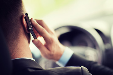 Image showing man using phone while driving the car