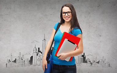 Image showing smiling student with bag, folders and tablet pc