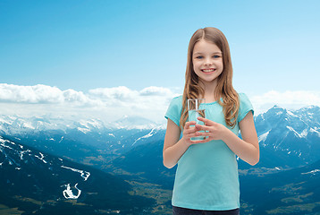 Image showing smiling little girl with glass of water