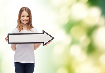 Image showing smiling girl with blank arrow pointing right