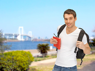 Image showing travelling student with backpack and book