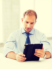 Image showing businessman with tablet pc in office