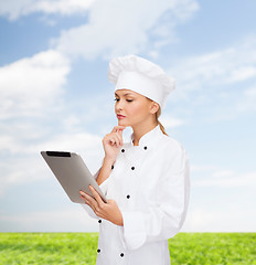 Image showing smiling female chef with tablet pc computer