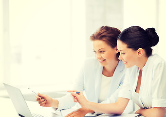 Image showing businesswomen working with laptop in office