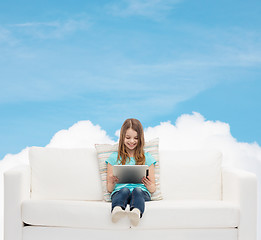 Image showing little girl sitting on sofa with tablet pc