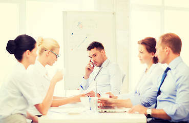 Image showing stressed male boss on business meeting