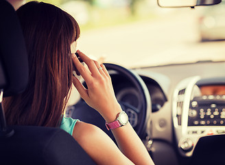 Image showing woman using phone while driving the car