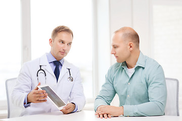 Image showing doctor with tablet pc and patient in hospital