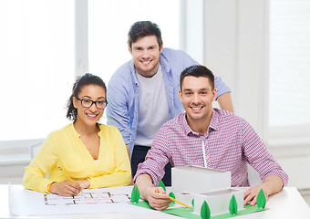 Image showing smiling architects working in office