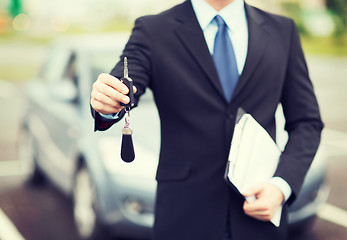 Image showing man with car key outside