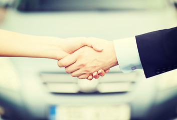 Image showing customer and salesman shaking hands