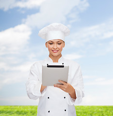 Image showing smiling female chef with tablet pc computer