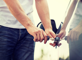 Image showing man with car key outside