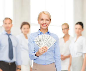 Image showing young businesswoman with dollar cash money