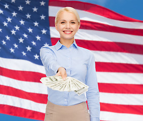 Image showing young businesswoman with dollar cash money