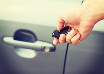 Image showing man with car key outside