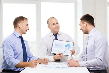 Image showing smiling businessmen with papers in office