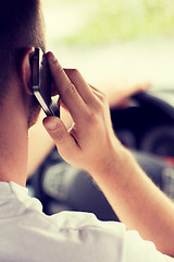 Image showing man using phone while driving the car