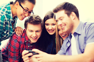 Image showing students looking at smartphone at school