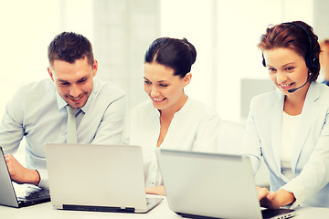 Image showing group of people working with laptops in office