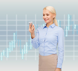 Image showing young smiling businesswoman with smartphone