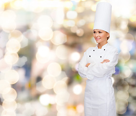 Image showing smiling female chef with crossed arms