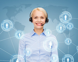 Image showing friendly female helpline operator with headphones