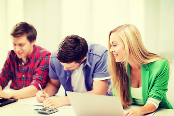 Image showing students writing test or exam in lecture at school