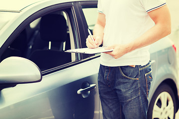 Image showing man with car documents