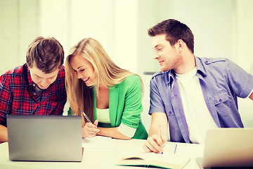 Image showing students writing something at school