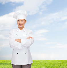 Image showing smiling female chef with crossed arms