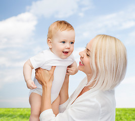 Image showing happy mother with smiling baby