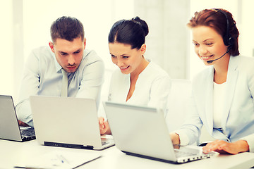 Image showing group of people working with laptops in office